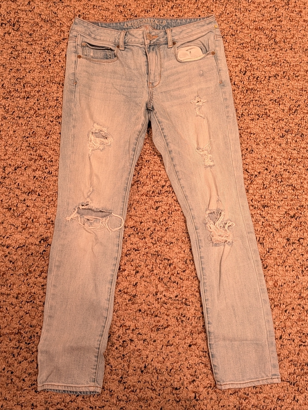 Distressed light wash skinny jeans